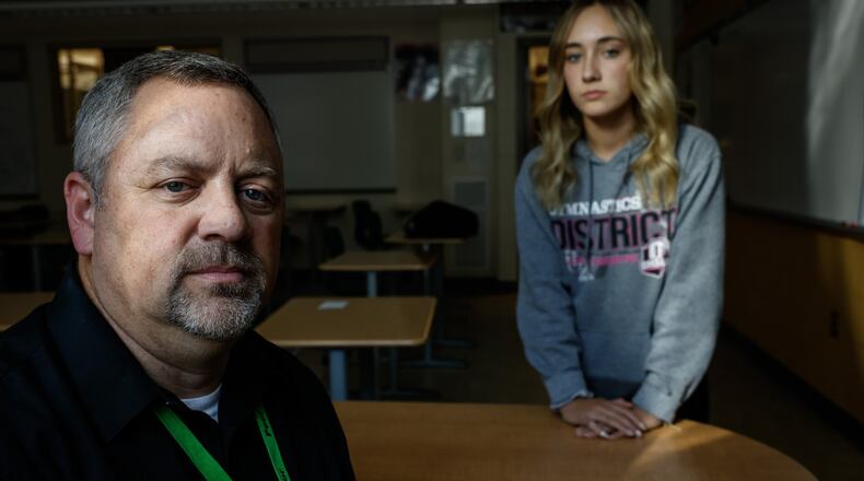 Northmont High School history teacher Matt Maiken and his daughter, Chiloe remember September 11, 2001.Local educators must now teach what happened September 11, 2001 to high school student born years after 911. JIM NOELKER/STAFF