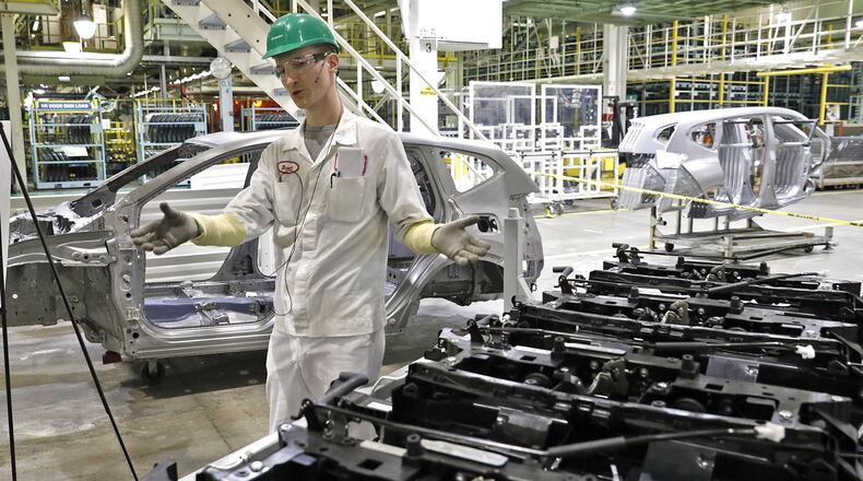 Scott King explains how the new component front end attaches to the new frame of the 2017 Honda CRV at the company’s East Liberty manufacturing plant. Honda will invest $124 million to build a new wind tunnel in East Liberty. Bill Lackey/Staff
