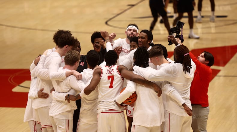 Dayton huddles before a game against Canisius on Monday, Nov. 3, 2025, at UD Arena. David Jablonski/Staff
