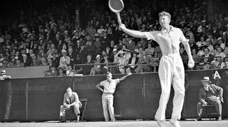 Budge in 1937 following through on his legendary backhand. (State Library of New South Wales)