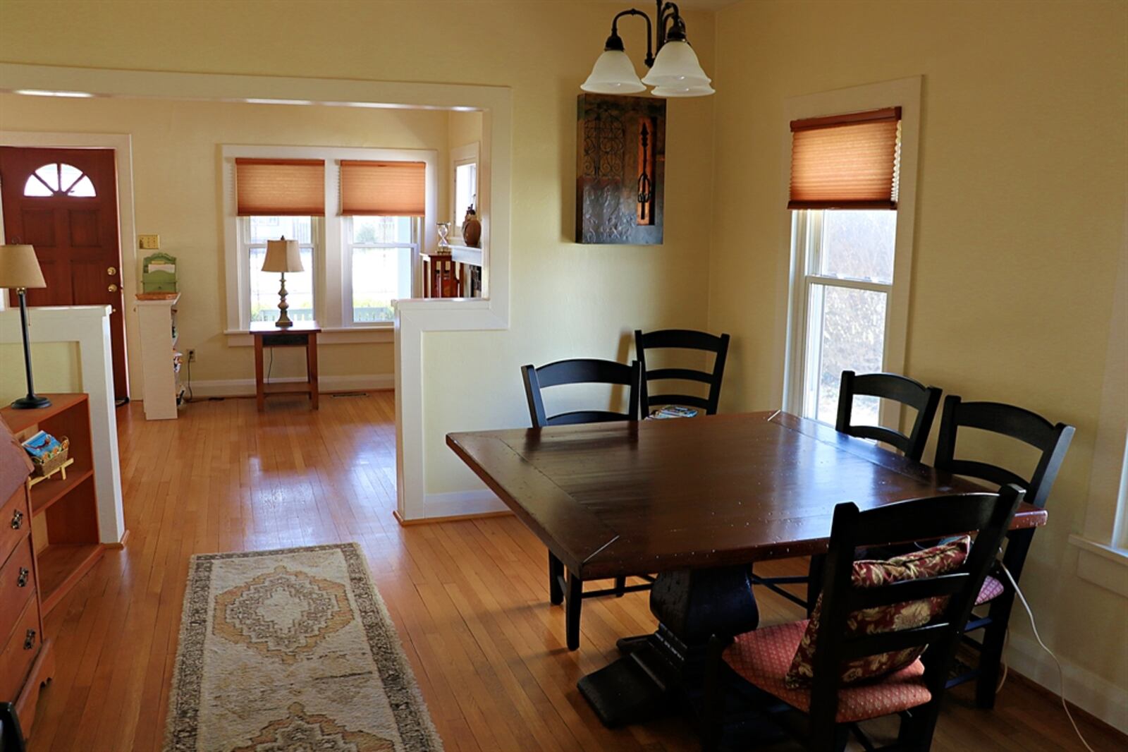 Partial walls divide the living room from the formal dining room, which is the center of the home. 