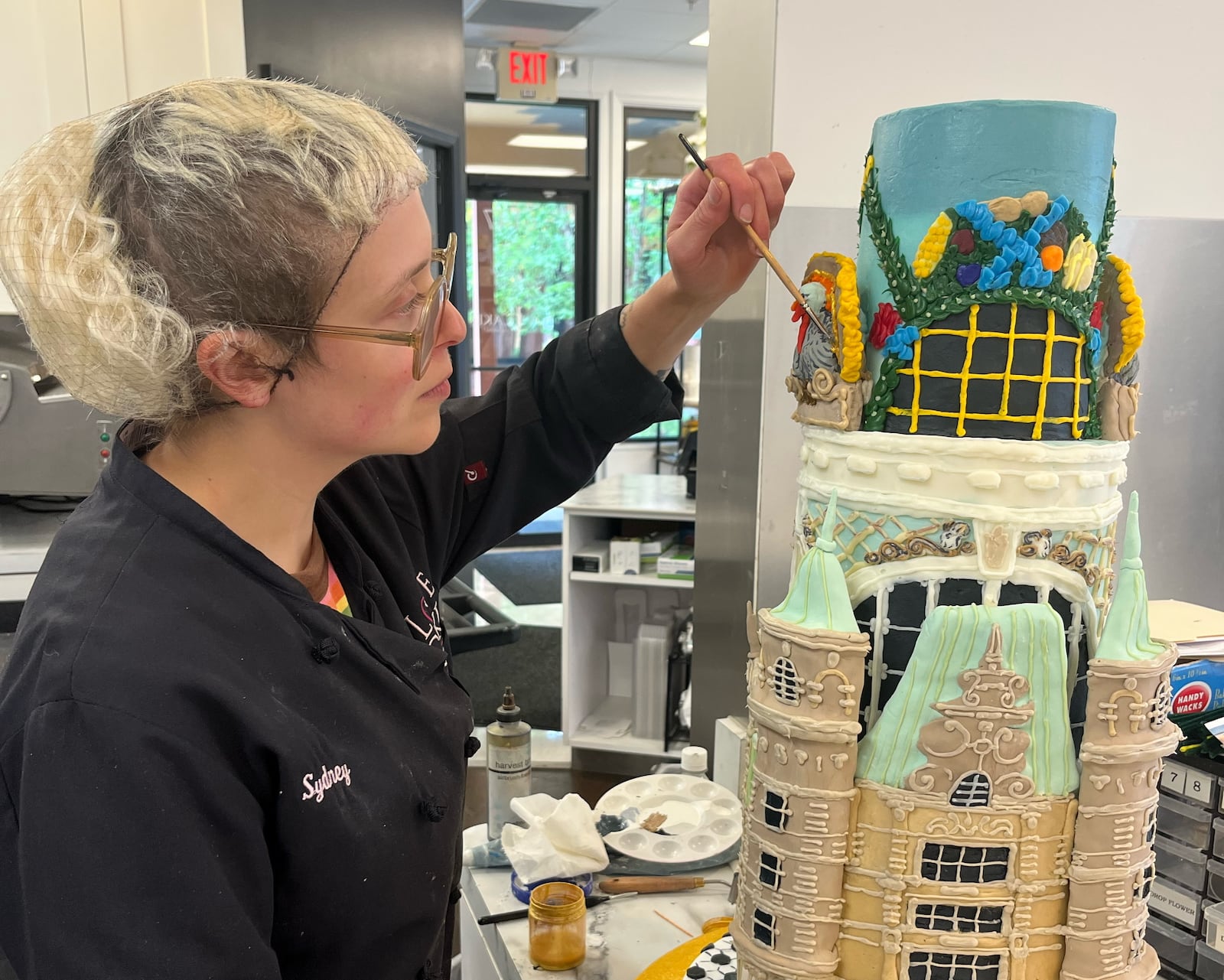 Joslin-Knapp, also a professional cake designer, was recently awarded Honorable Mention for the public vote in the “Great Dayton Cake Off” competition for their rendering of the historic Dayton Arcade. “I’m fortunate that Dorothy Lane Market was very supportive throughout the entire endeavor. It was a wonderful way to represent myself as Sydney the artist and Sydney the cake designer.” STEPHANIE CARRAHER/CONTRIBUTED PHOTO