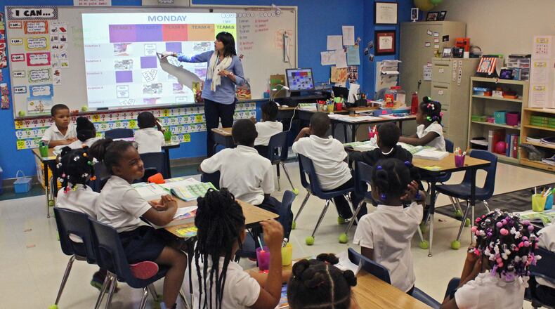 Dayton Leadership Academy students work with a teacher in 2014. Chuck Hamlin / Staff