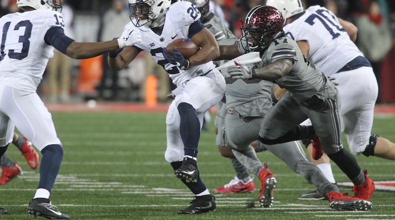 Ohio State’s Jerome Baker (17) pursues Penn State’s Saquon Barkley on Saturday, Oct. 28, 2017, at Ohio Stadium in Columbus. David Jablonski/Staff