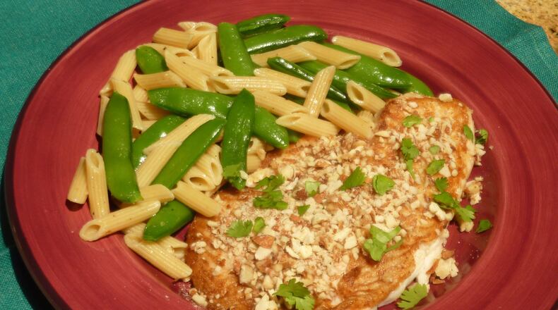 Sole Almondine (Almond-Crusted Sole) with Penne and Sugar Snap Peas. (Linda Gassenheimer/TNS)