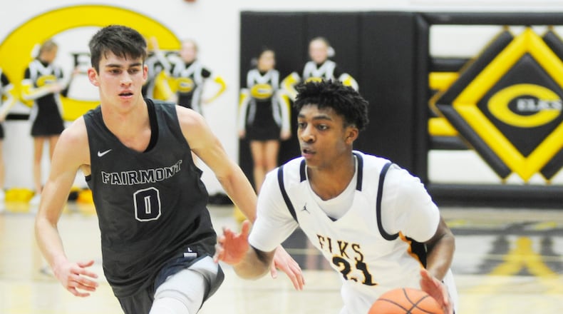 Centerville’s Kaleb Mitchell (right) is guarded by Fairmont’s Ryan Hall during an early December game. Host Fairmont will play Crestwood Prep (Canada) in the Premier Health Flyin’ to the Hoop opener at 6:30 p.m. Friday. Centerville gets Olentangy Liberty at 3 p.m. Saturday. MARC PENDLETON / STAFF