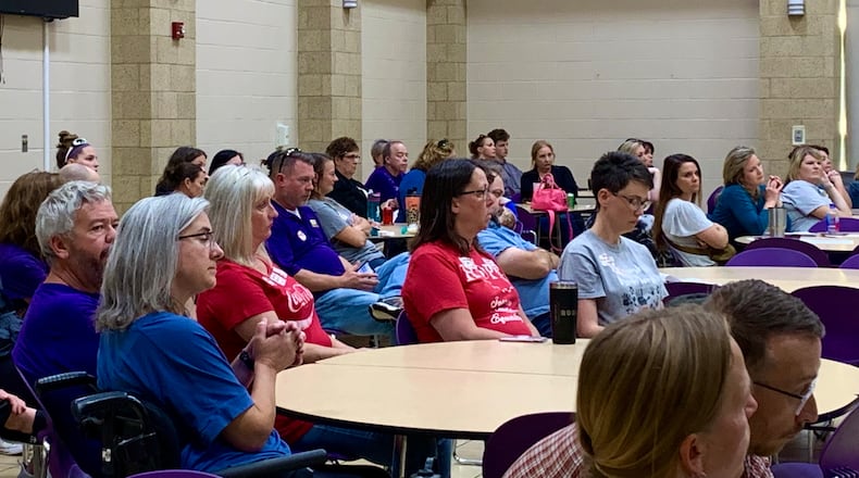 Staff and parents listen in the audience at Bellbrook-Sugarcreek Schools as the district, city, and township discuss funding for School Resource Officers Monday. LONDON BISHOP/STAFF