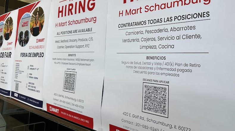 FILE - Hiring sign is displayed at a grocery store in Niles, Ill., Tuesday, Dec. 30, 2025. (AP Photo/Nam Y. Huh)