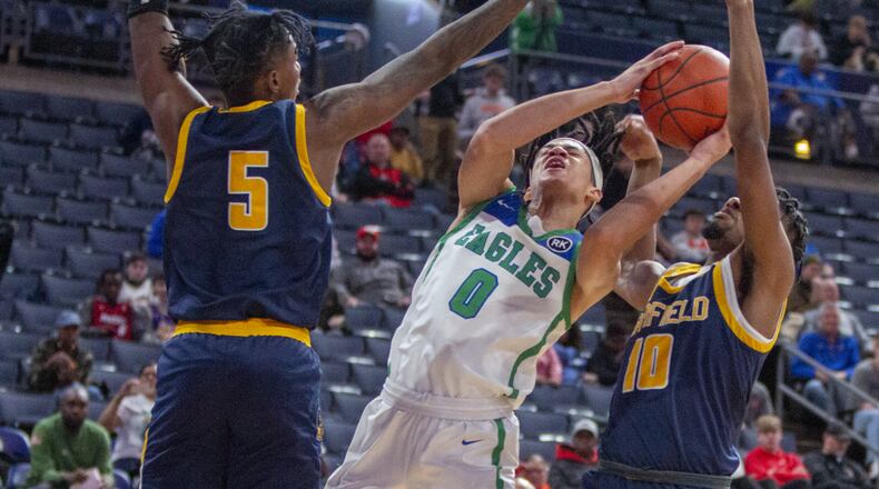 Chaminade Julienne senior Evan Dickey is fouled by Garfield Heights' Calvin Little Jr. (10) during Saturday's game at Nationwide Arena. CONTRIBUTED BY JEFF GILBERT