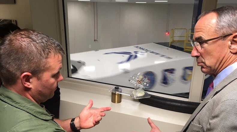 Capt. Adam Lohn, flight commander, Acceleration Branch, at the United States Air Force School of Aerospace Medicine, 711th Human Performance Wing’s centrifuge training and research facility discusses current training program requirements with National Commission on Military Aviation Safety commissioner retired Air Force Gen. Raymond E. Johns Sept. 11 during the commission’s visit to Wright-Patterson Air Force Base. The facility is the only human-rated centrifuge owned by the Department of Defense and provides training to approximately 1,200 students a year. (Courtesy photo/Bryan Whitman)