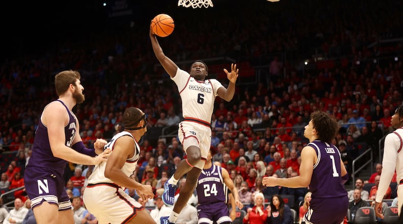 Dayton's Enoch Cheeks dunks in the second half against Northwestern on Saturday, Nov. 9, 2024, at UD Arena. David Jablonski/Staff
