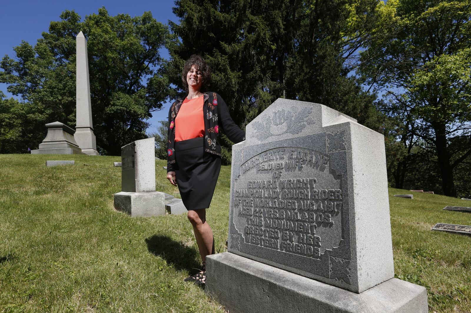 Angie Hoschouer, manager of development and marketing for Woodland Historic Cemetery Arboretum & Foundation, has created a tour of area sports legends at the cemetery. One of the stops will be Maggie Doane’s grave. Doan, who died in 1917, was a champion rodeo rider. LISA POWELL / STAFF
