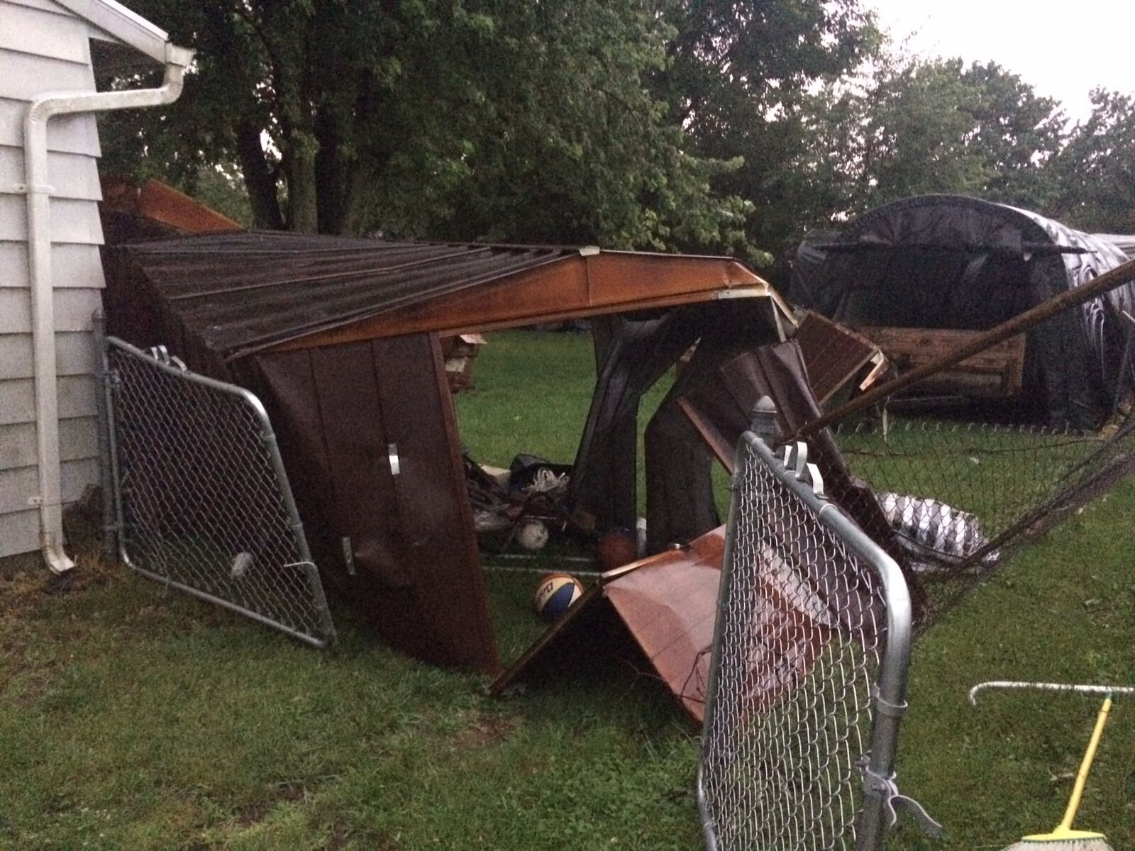 A mangled shed can be seen in the front yard of this Springfield home near Providence Road. (Robert Yontz/Contributed)