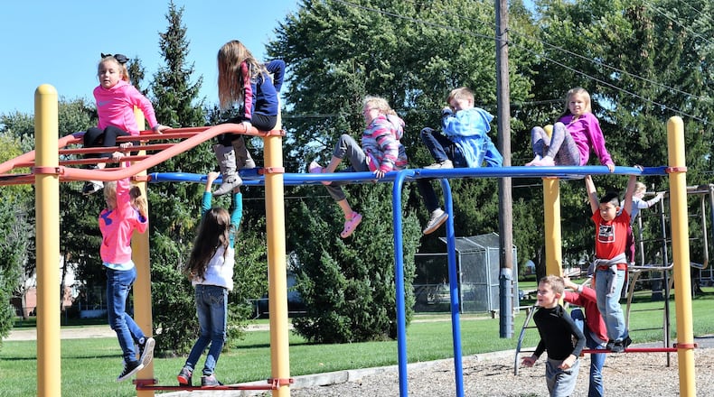 Students at Troy’s Cookson Elementary School spend time on the school’s playground. The school district is asking voters to approve a bond issue to build two new schools, one for prekindergarten through grade two students and the other for grades three through six. CONTRIBUTED