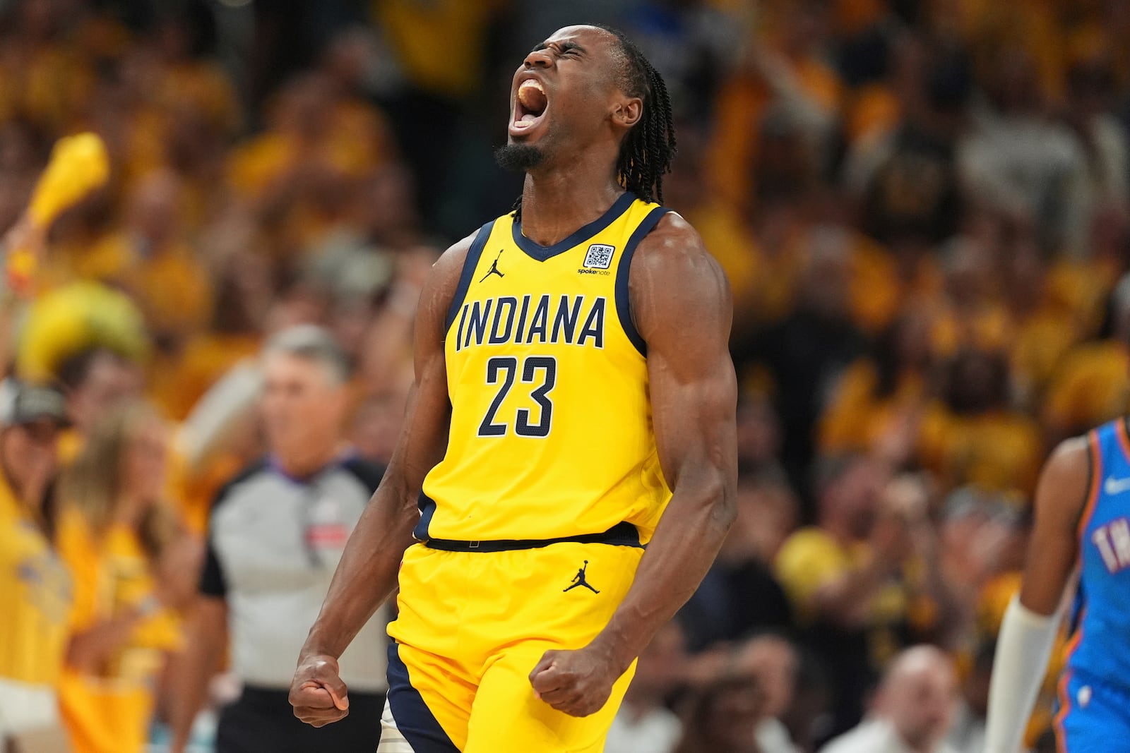 Indiana Pacers forward Aaron Nesmith reacts after a basket against the Oklahoma City Thunder during the first half of Game 4 of the NBA Finals basketball series, Friday, June 13, 2025, in Indianapolis. (AP Photo/Michael Conroy)