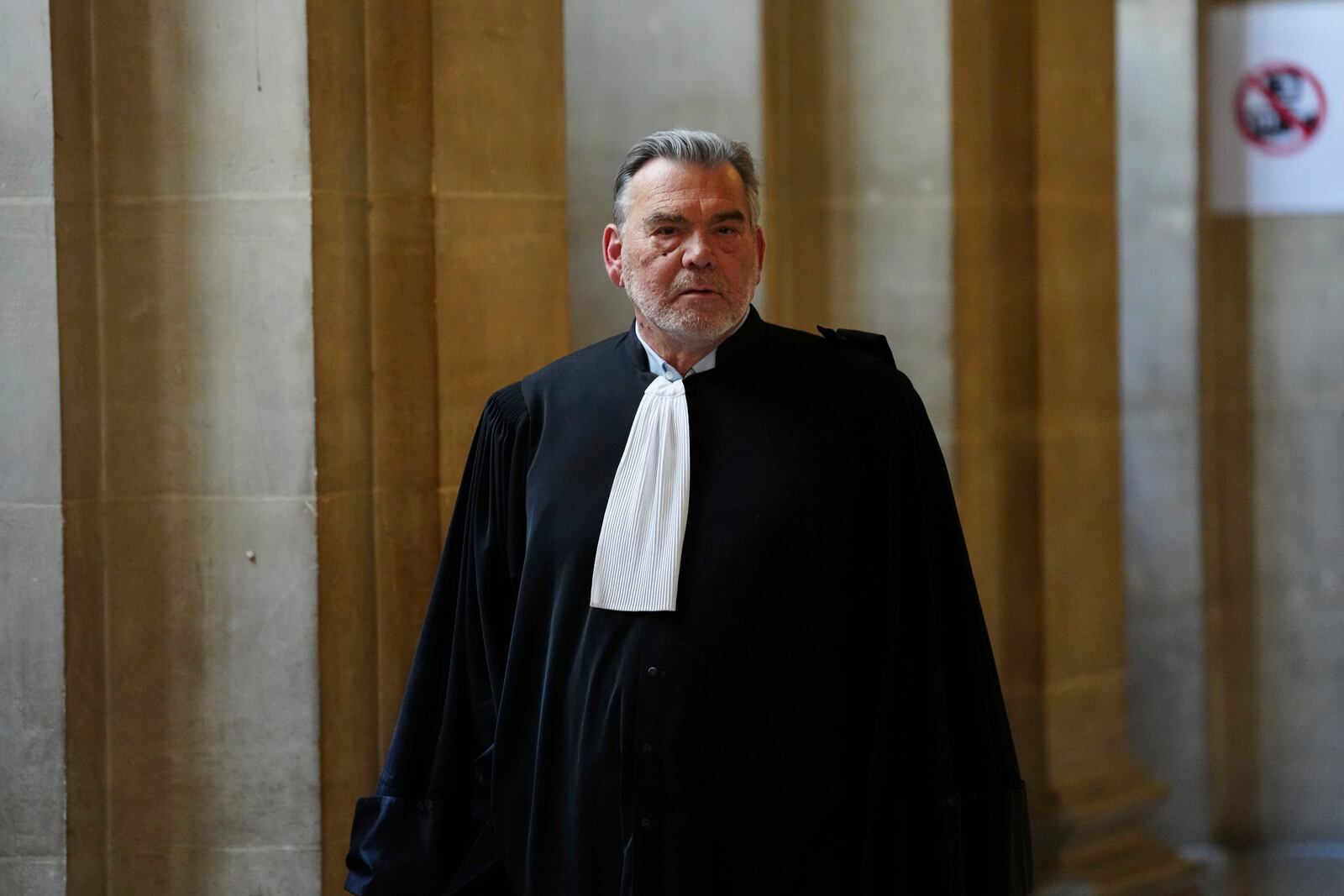 Franck Berton, a lawyer for Aomar Aït Khedache, one of the men accused in the 2016 armed robbery of Kim Kardashian, leaves during a break at the palace of justice Monday, April 28, 2025 in Paris. (AP Photo/Aurelien Morissard)