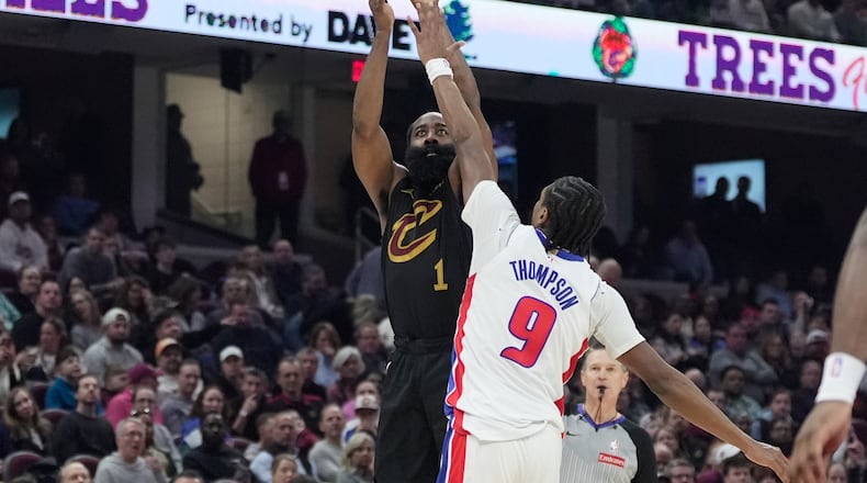 Cleveland Cavaliers guard James Harden (1) shoots as Detroit Pistons guard Ausar Thompson (9) defends in the first half of an NBA basketball game in Cleveland, Tuesday, March 3, 2026. (AP Photo/Sue Ogrocki)