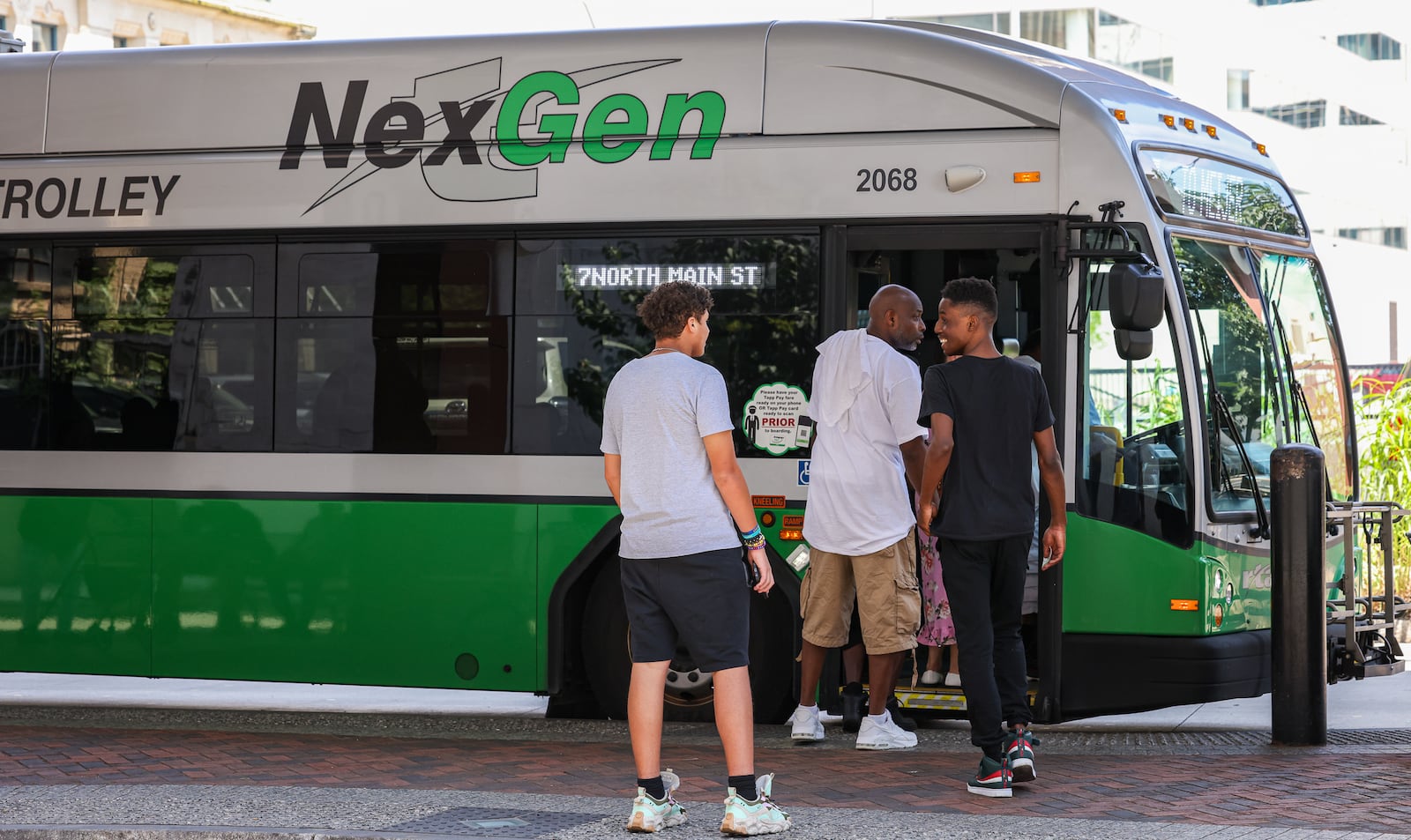 Passengers enter a Greater Dayton RTA bus at Wright Stop Plaza Transit Center on Friday, June 27. BRYANT BILLING / STAFF
