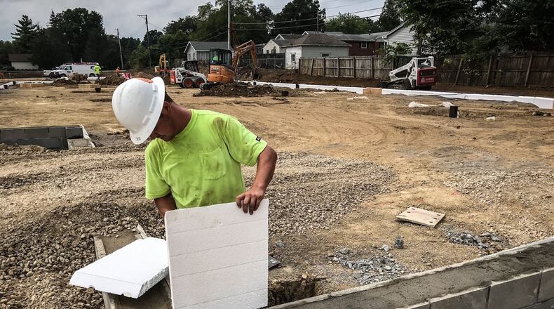Jake Kingsolbor works on the foundation of a new Kettering Health Network building on East Stroop Rd. Tuesday September 1, 2020. Jim Noelker/Staff