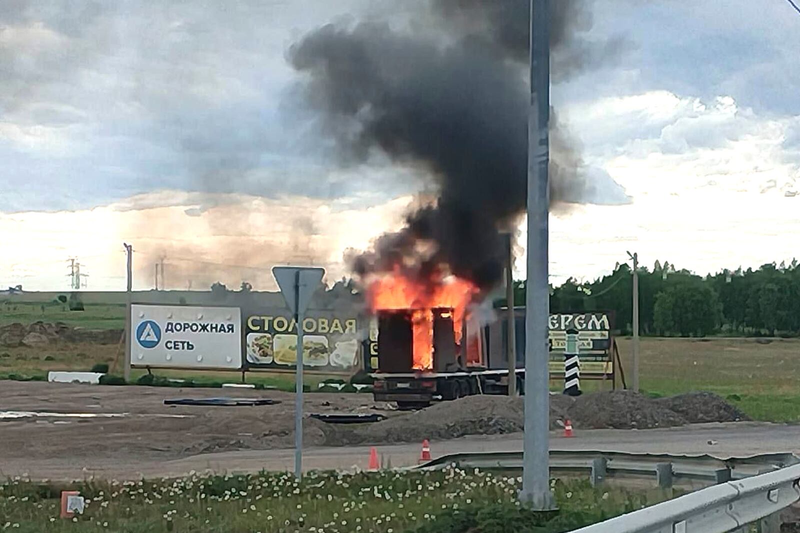 This photo released by Governor of Irkutsk region Igor Kobzev telegram channel on Sunday, June 1, 2025, shows a truck apparently used to release Ukrainian drones seen burning in the Irkutsk region, more than 4,000 kilometers (2,500 miles) from Ukraine. (Governor of Irkutsk region Igor Kobzev telegram channel via AP)