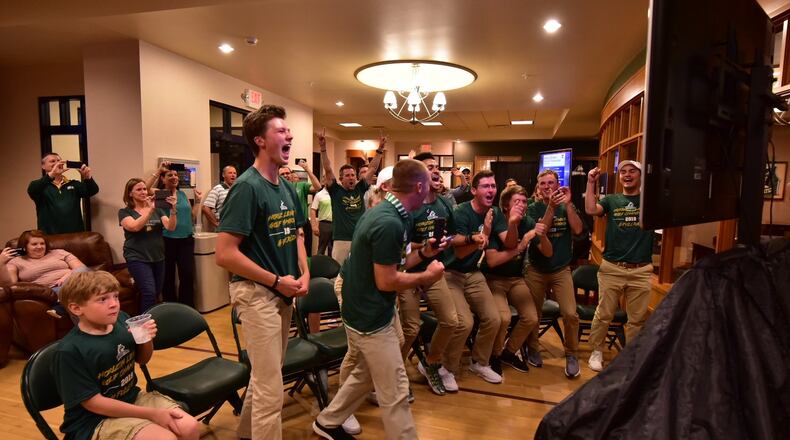 Members of the Wright State golf team react after hearing their name called on the NCAA Tournament selection show Wednesday night. Joseph Craven/CONTRIBUTED