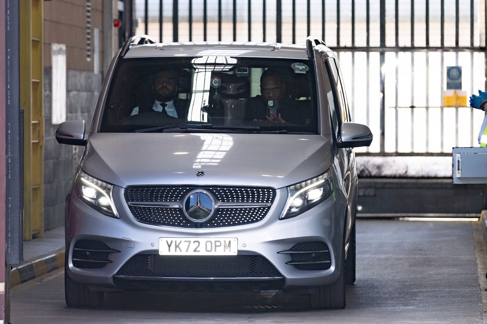 A vehicle believed to be carrying R&B singer Chris Brown leaves HMP Forest Bank in Salford, England, after he was freed on bail, Wednesday May 21, 2025. (James Speakman/PA via AP)