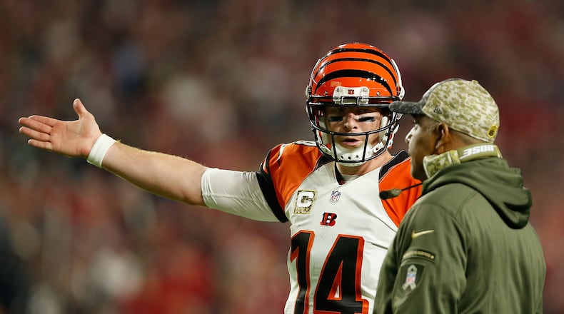 GLENDALE, AZ - NOVEMBER 22: Quarterback Andy Dalton #14 of the Cincinnati Bengals (left) talks with head coach Marvin Lewis (right) during the first half of the NFL game against the Arizona Cardinals at the University of Phoenix Stadium on November 22, 2015 in Glendale, Arizona.  (Photo by Christian Petersen/Getty Images)