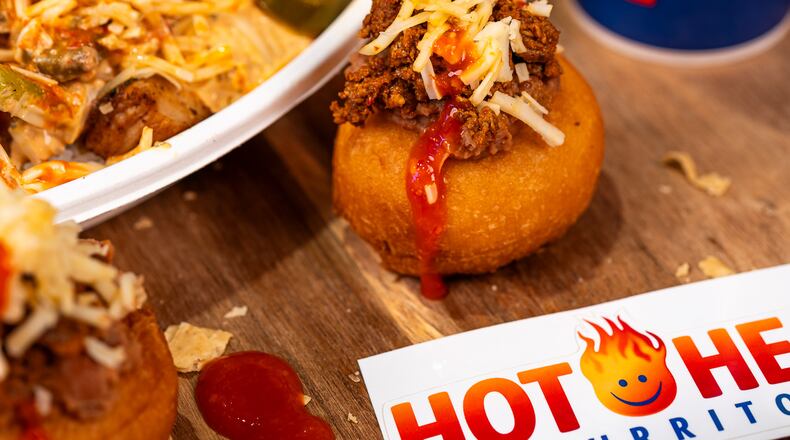 Death Grip Donuts and Hot Head Burritos are teaming up for two special pop-up events at The Mall at Fairfield Commons in Beavercreek. Pictured is The Reaper, a donut filled with chorizo and refried beans, smothered in ghost pepper sauce and topped with shredded reaper cheese (CONTRIBUTED PHOTO).