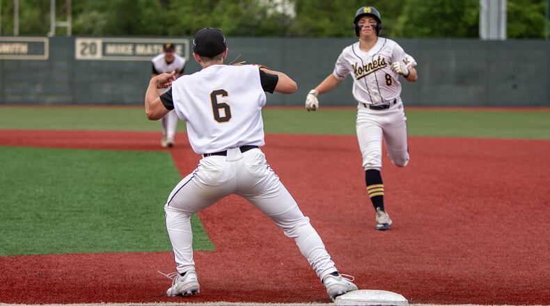 Centerville first baseman Jackson Clark catches a throw from left fielder Colten Burleson to double Monroe's Tyler Gannon off first base for a game-ending double play Friday at Wright State. Jeff Gilbert/CONTRIBUTED