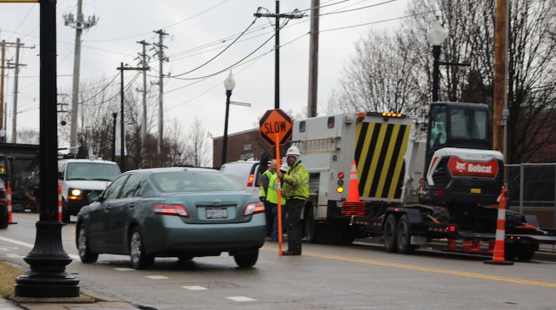 Vectren crews work on Valley Street in Old North Dayton on Monday. CORNELIUS FROLIK / STAFF