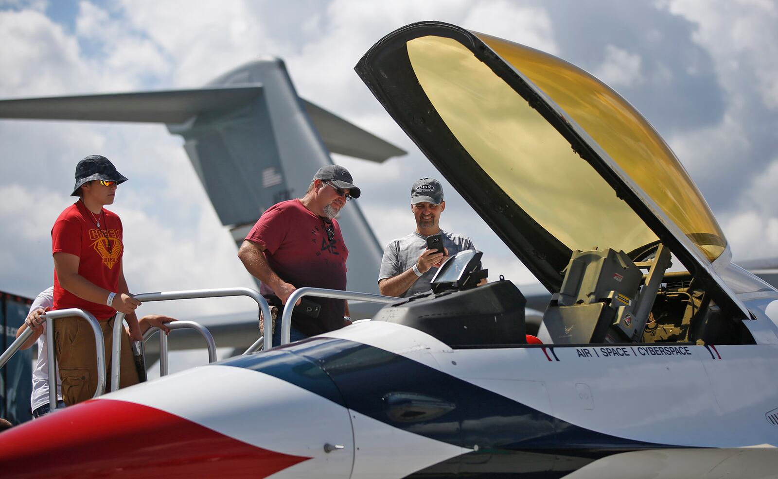 An Air Force F-16 painted in Thunderbird colors on display Sunday at the Vectren Dayton Air Show.   TY GREENLEES / STAFF