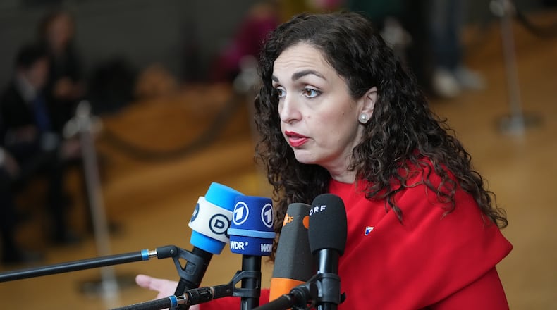 FILE - Kosovo's President Vjosa Osmani-Sadriu speaks with the media as she arrives for an EU-Western Balkans Summit at the European Council building in Brussels, Wednesday, Dec. 17, 2025. (AP Photo/Virginia Mayo, File)