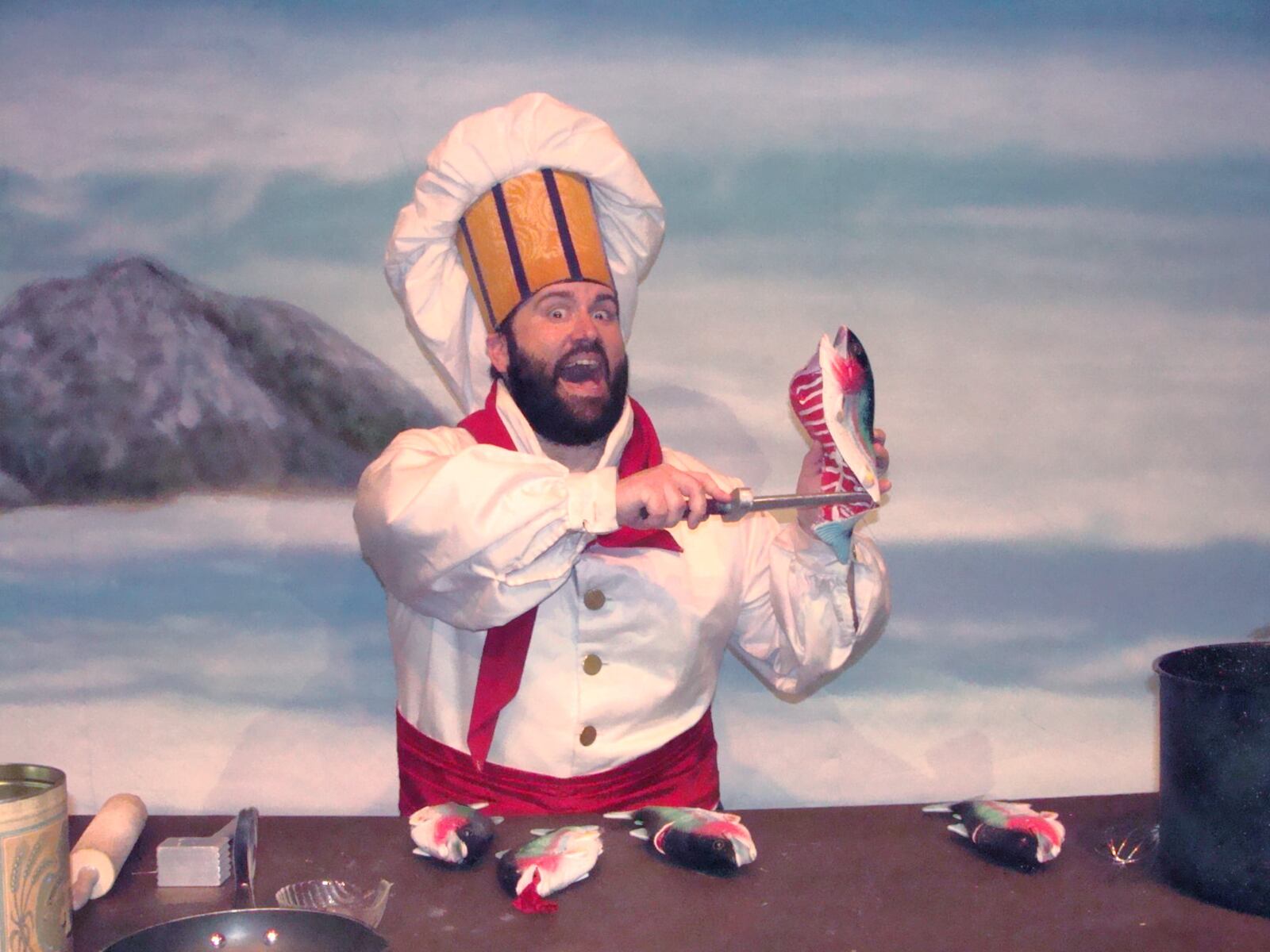 Digger Howard (Chef Louis) sings "Les Poissons" in La Comedia Dinner Theatre's production of "The Little Mermaid."