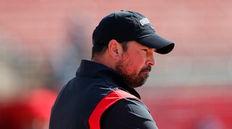 Ohio State head coach Ryan Day watches warm ups before an NCAA college football game against Rutgers, Saturday, Oct. 2, 2021, in Piscataway, N.J. (AP Photo/Noah K. Murray)