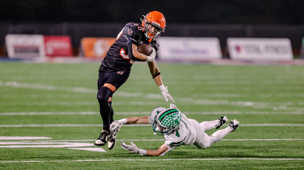 The Coldwater High School football team beat Anna 14-12 on Friday, Nov. 21 at Piqua's Alexander Stadium to win the Division VI, Region 24 championship. MICHAEL COOPER / STAFF PHOTO