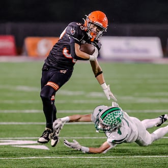 The Coldwater High School football team beat Anna 14-12 on Friday, Nov. 21 at Piqua's Alexander Stadium to win the Division VI, Region 24 championship. MICHAEL COOPER / STAFF PHOTO