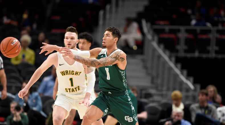 Wright State’s Bill Wampler defends Green Bay’s Sandy Cohen during Monday’s game at Little Caesars Arena in Detroit. Jose Juarez/CONTRIBUTED