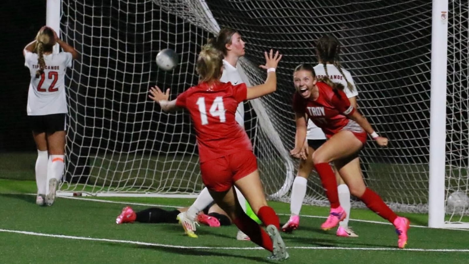 Troy sophomore Avery Noll (17) smiles after scoring and junior Jillian Blair celebrates during a recent competition. DANNY DICEANU
