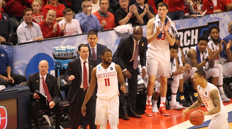 Dayton’s Archie Miller, left, coaches during the NCAA tournament against Wichita State on March 17, 2017, at Bankers Life Fieldhouse in Indianapolis. David Jablonski/Staff