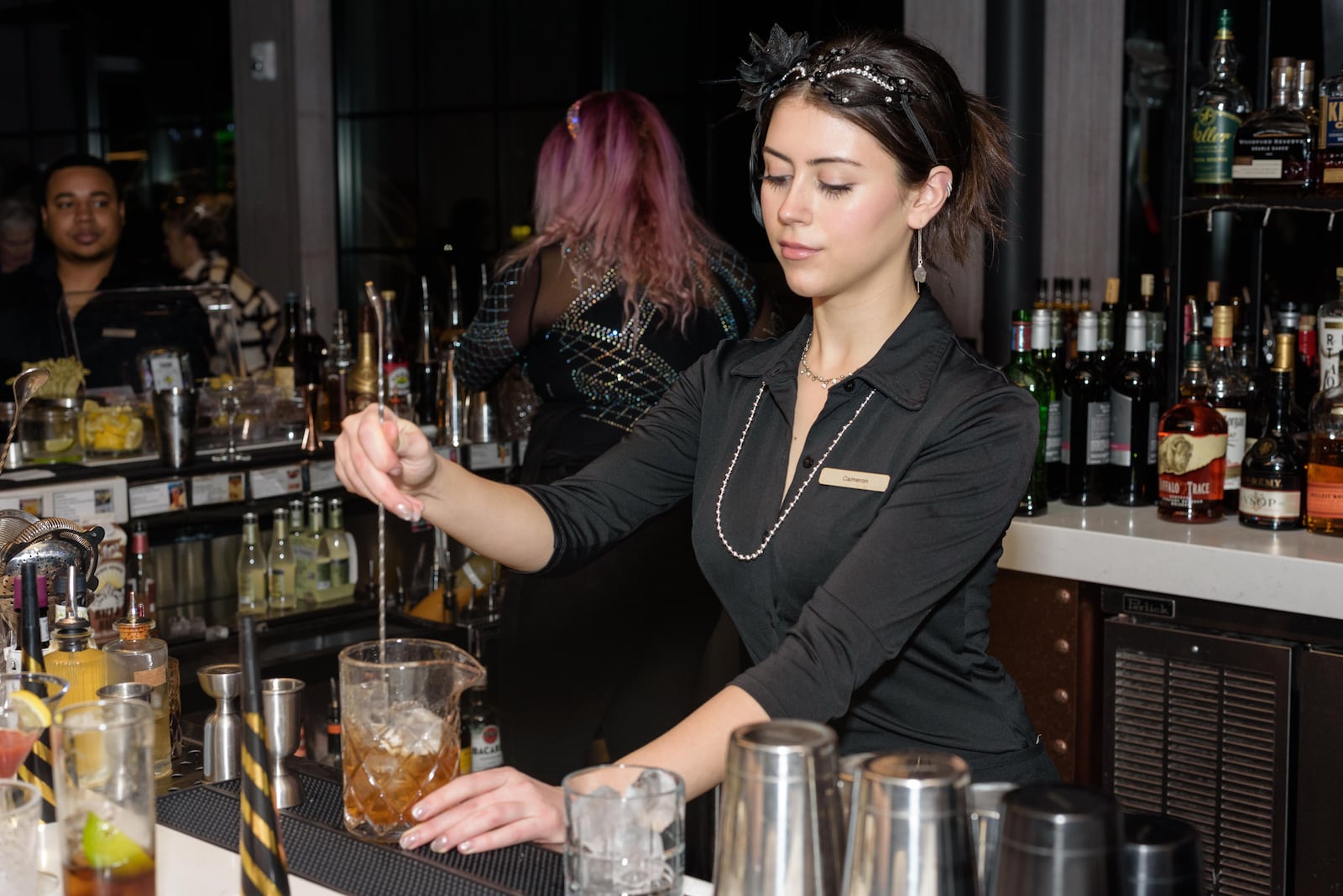 The Foundry Rooftop bar & restaurant at the AC Hotel by Marriott in downtown Dayton held its first New Year’s Eve party Midnight Masquerade on Sunday, Dec. 31, 2023. TOM GILLIAM / CONTRIBUTING PHOTOGRAPHER