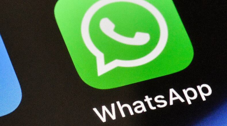 FILE - A WhatsApp icon is displayed on an iPhone, Nov. 15, 2018, in Gelsenkirchen, Germany. (AP Photo/Martin Meissner, File)