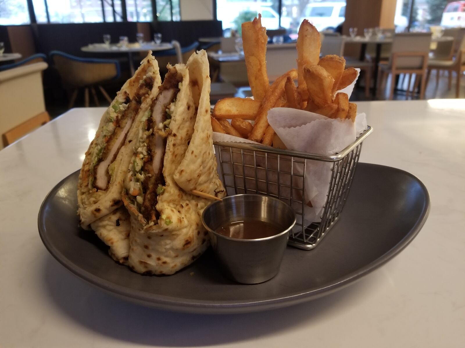 The menu at Dewberry 1850 includes crispy chicken  — crispy chicken breast, NC BBQ mayo, chopped brussel sprout slaw, naan bread