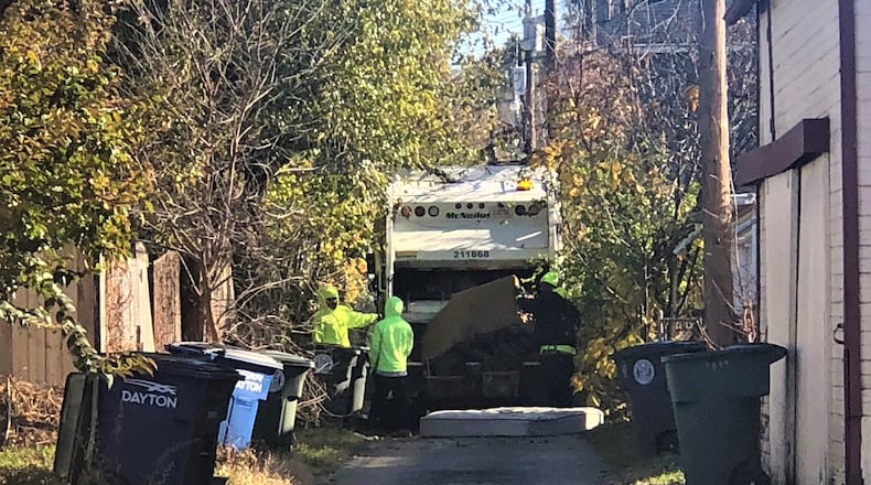 Dayton waste collection crews at work in the city. CORNELIUS FROLIK / STAFF