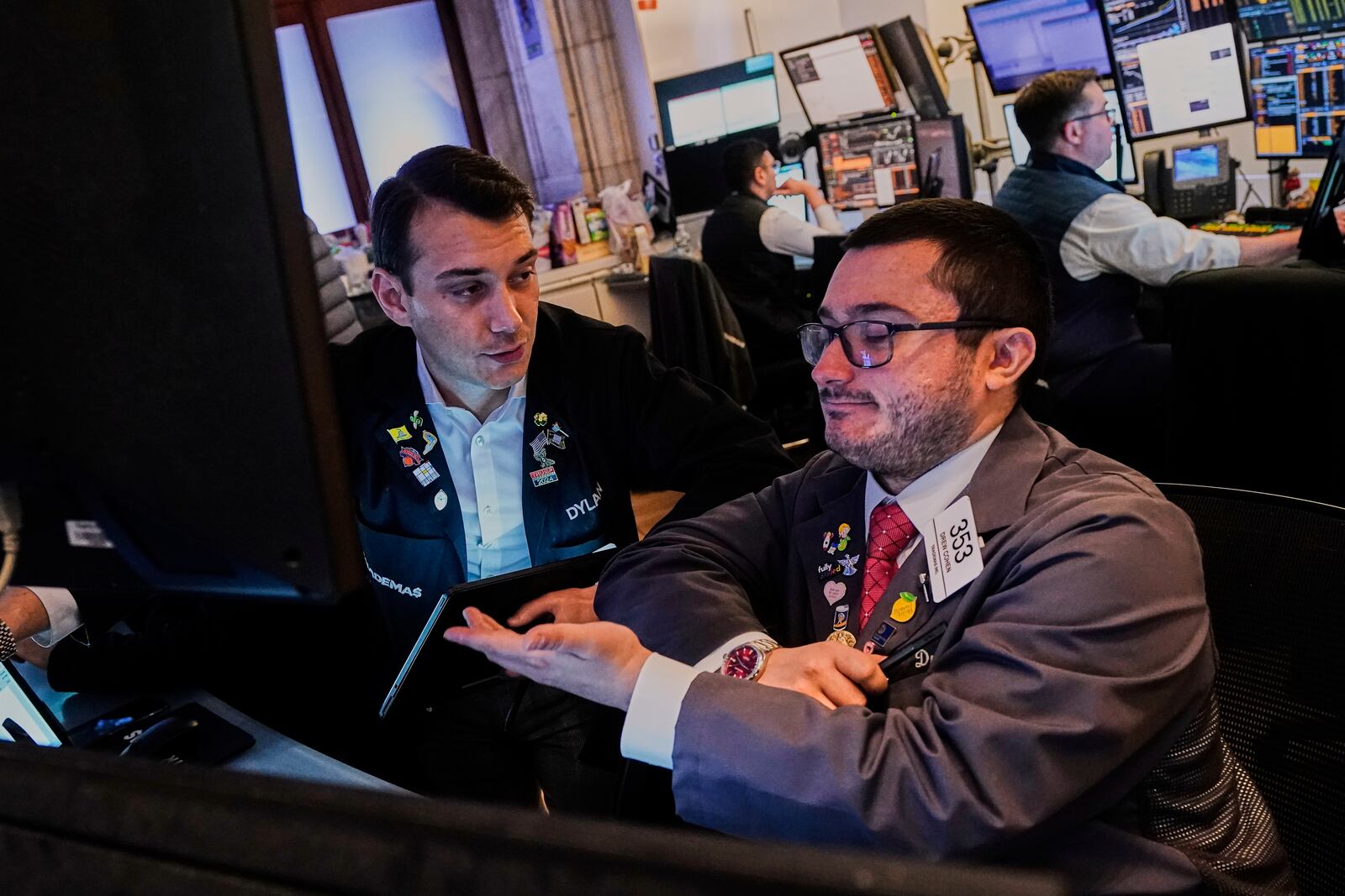 Traders Dylan Halvorsan, left, and Drew Cohen work on the floor of the New York Stock Exchange, Monday, June 9, 2025. (AP Photo/Richard Drew)