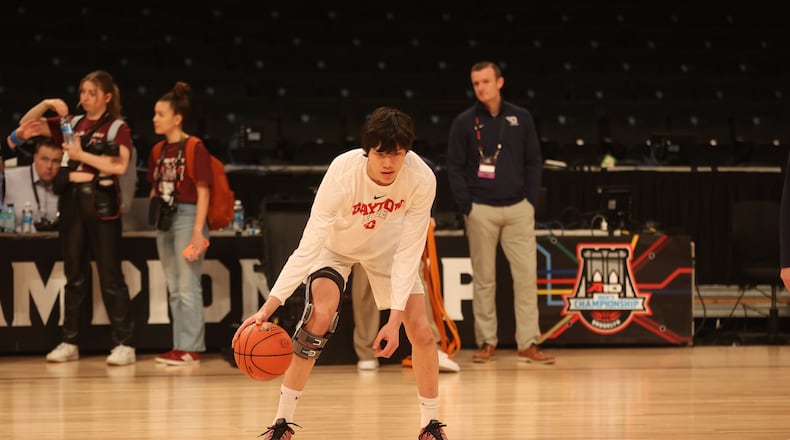 Dayton's Mike Sharavjamts warms up before a game against Saint Joseph’s in the quarterfinals of the Atlantic 10 Conference tournament on Thursday, March 9, 2023, at the Barclays Center in Brooklyn, N.Y. David Jablonski/Staff