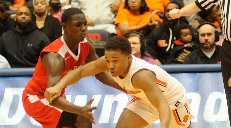 Doug Spear of Stivers (with ball) avoids a defender. MARC PENDLETON / STAFF