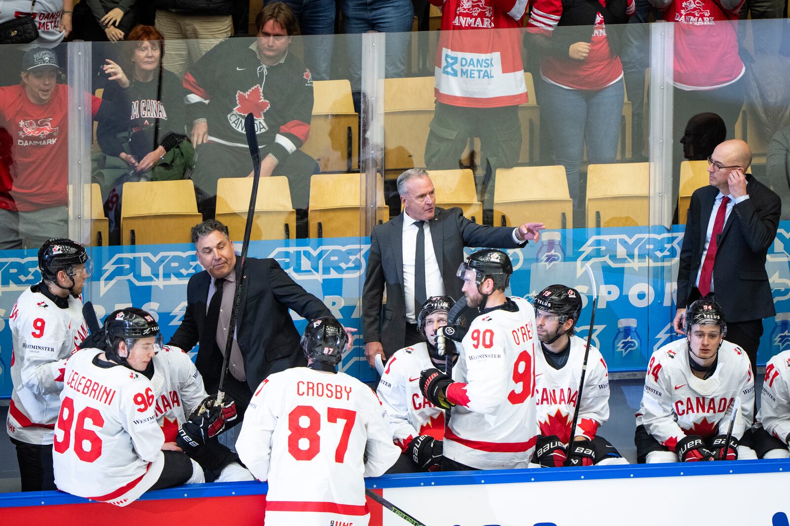 Canada's head coach Dean Evason, center rear, and his team react after a quarterfinal game between Canada and Denmark at the hockey world championships, Thursday, May 22, 2025, in Herning, Denmark. (Bo Amstrup/Ritzau Scanpix via AP)