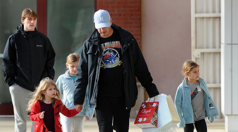 The Mathes family, from left, Gillian, 16, Parker, 4, Paisley, 9, James, and Piper, 4, were doing last minute Christmas shopping at the Greene Tuesday Dec. 20, 2022. MARSHALL GORBY\STAFF