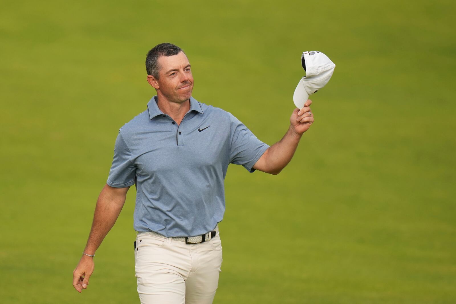 Rory McIlroy of Northern Ireland acknowledges the crowd as he walks onto the 18th green during the final round of the British Open golf championship at the Royal Portrush Golf Club, Northern Ireland, Sunday, July 20, 2025. (AP Photo/Francisco Seco)