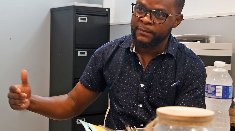 Viles Dorsainvil talks about the Haitian Community Center Wednesday, June 5, 2024 at the center on South Yellow Springs Street. BILL LACKEY/STAFF